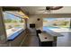 Entertainers dream pool area with outdoor kitchen, bar, and seating for relaxing fun at 28093 N Pasture Canyon Dr, San Tan Valley, AZ 85143