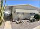 Charming manufactured home with mature landscaping and covered parking at 305 S Val Vista Dr # 243, Mesa, AZ 85204