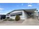 Nicely landscaped manufactured home with carport and sidewalk. Well-maintained and move-in ready at 305 S Val Vista Dr # 243, Mesa, AZ 85204