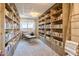 Serene library space features floor-to-ceiling bookshelves and cozy seating at 305 S Val Vista Dr # 243, Mesa, AZ 85204