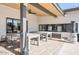 Covered patio boasts modern seating, sleek ceiling fan, and contemporary design, perfect for outdoor entertaining and relaxation at 305 S Val Vista Dr # 243, Mesa, AZ 85204
