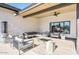 Inviting outdoor patio with comfortable seating, stylish ceiling fan and heater at 305 S Val Vista Dr # 243, Mesa, AZ 85204