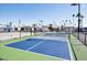 Well-maintained community pickleball courts surrounded by palm trees at 305 S Val Vista Dr # 243, Mesa, AZ 85204
