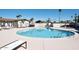 Sparkling community pool area with lounge chairs and desert landscaping at 305 S Val Vista Dr # 243, Mesa, AZ 85204