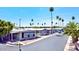 Street view of manufactured homes with desert landscaping and palm trees at 305 S Val Vista Dr # 243, Mesa, AZ 85204