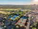 Beautiful aerial view highlighting the tennis courts, pool, and golf course in the community at 31108 N 122Nd Ln, Peoria, AZ 85383
