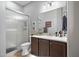 Clean bathroom with a modern vanity, large mirror, walk-in shower, and tiled floor at 31108 N 122Nd Ln, Peoria, AZ 85383