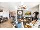 Inviting living room with a fireplace, media center, comfortable seating, and an open floor plan at 31108 N 122Nd Ln, Peoria, AZ 85383