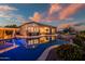 Backyard pool at sunset showcasing a luxurious outdoor living space with a spa, and pergola at 31108 N 122Nd Ln, Peoria, AZ 85383
