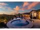 Backyard pool and spa at sunset, offering a serene retreat for relaxation and leisure at 31108 N 122Nd Ln, Peoria, AZ 85383