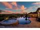 Backyard pool and spa at sunset, creating a tranquil oasis for relaxation and recreation at 31108 N 122Nd Ln, Peoria, AZ 85383