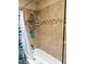 Bathroom showcases bathtub with tiled walls and modern fixtures at 3231 N 81St Pl, Scottsdale, AZ 85251