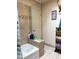 Bathroom with a bathtub, decorative tile accents, and a large mirror at 3231 N 81St Pl, Scottsdale, AZ 85251
