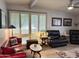 Comfortable living room with plantation shutters, decorative furnishings, and cozy seating arrangement at 3231 N 81St Pl, Scottsdale, AZ 85251