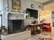 Bright living room with a fireplace, neutral paint, decorative accents, and access to the kitchen at 3231 N 81St Pl, Scottsdale, AZ 85251