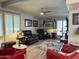 Cozy living room with plush seating, plantation shutters, and stylish decor creating a comfortable ambiance at 3231 N 81St Pl, Scottsdale, AZ 85251