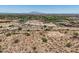 Large desert property displaying community views and access road at 3284 W Highlands Dr, Buckeye, AZ 85396