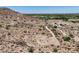 Expansive desert home site showcasing access roads, mountain views, and the surrounding neighborhood at 3284 W Highlands Dr, Buckeye, AZ 85396