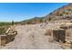 Desert landscape with concrete features on a sunny day showcasing the lot and surrounding terrain at 3284 W Highlands Dr, Buckeye, AZ 85396