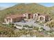 Stunning desert home featuring a tile roof, grand entrance, and beautifully landscaped surroundings at 3284 W Highlands Dr, Buckeye, AZ 85396