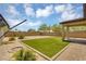Landscaped backyard featuring gravel, small bushes and a covered patio at 33731 N Bowles Dr, San Tan Valley, AZ 85144