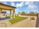 Backyard featuring desert landscaping, gravel, small bushes, partial wall and small covered patio at 33731 N Bowles Dr, San Tan Valley, AZ 85144