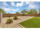 Landscaped backyard featuring gravel, small bushes and partial wall at 33731 N Bowles Dr, San Tan Valley, AZ 85144