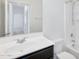 Bright bathroom featuring a vanity with a sink, a mirror, and a shower-tub combo at 33731 N Bowles Dr, San Tan Valley, AZ 85144
