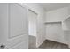 Walk-in closet featuring carpet floors, white walls and a hanging rod at 33731 N Bowles Dr, San Tan Valley, AZ 85144