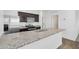 Close-up of a modern kitchen with stainless steel appliances and granite countertops at 33731 N Bowles Dr, San Tan Valley, AZ 85144