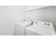 Laundry room with white washer and dryer machines at 33731 N Bowles Dr, San Tan Valley, AZ 85144