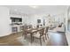 Open-concept living and dining area with hardwood floors and a view into the modern kitchen at 33731 N Bowles Dr, San Tan Valley, AZ 85144