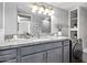 Updated bathroom features granite countertops, modern fixtures, and a washing machine at 3416 N 44Th St # 70, Phoenix, AZ 85018
