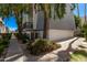 Exterior view of a bright condo with mature trees adding natural beauty to the well-maintained property and a touch of shade at 3416 N 44Th St # 70, Phoenix, AZ 85018