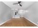 Spacious living area with sleek ceiling fan and open layout to kitchen at 3416 N 44Th St # 70, Phoenix, AZ 85018