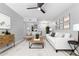 Bright living room with modern decor, ceiling fan, and view of kitchen at 3416 N 44Th St # 70, Phoenix, AZ 85018