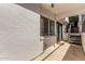 Private patio with a sliding glass door and staircase leading to a peaceful area for relaxing and entertaining at 3416 N 44Th St # 70, Phoenix, AZ 85018