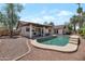 Aerial view of backyard pool with covered patio, lush landscaping, and gravel at 350 E Huber St, Mesa, AZ 85201