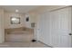 Bright bathroom with a large tub and a separate shower at 350 E Huber St, Mesa, AZ 85201