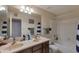 This bathroom features a double sink vanity, a shower, and a toilet at 350 E Huber St, Mesa, AZ 85201