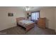 Bedroom featuring ceiling fan, carpet and dresser at 350 E Huber St, Mesa, AZ 85201