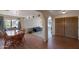 Open-concept dining area with hardwood floors and lots of natural light at 350 E Huber St, Mesa, AZ 85201