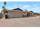 Attached two-car garage and long driveway offers lots of parking space at 350 E Huber St, Mesa, AZ 85201