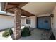 Inviting covered front porch with light blue front door and decorative wreath at 350 E Huber St, Mesa, AZ 85201