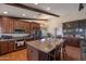 Spacious kitchen boasts wood cabinets, granite countertops and stainless steel appliances at 350 E Huber St, Mesa, AZ 85201