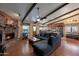Spacious living room with fireplace, beamed ceilings and adjacent kitchen at 350 E Huber St, Mesa, AZ 85201