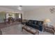 Inviting open-concept living room with tile flooring, and adjacent dining area at 350 E Huber St, Mesa, AZ 85201