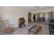 Comfortable living room with tile floors and neutral tones with a view to the dining room at 350 E Huber St, Mesa, AZ 85201