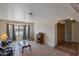 Spacious living room with tile floors, large windows, and warm, neutral tones at 350 E Huber St, Mesa, AZ 85201