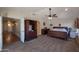 Spacious main bedroom with carpet, vaulted ceiling, and walk-in closet at 350 E Huber St, Mesa, AZ 85201
